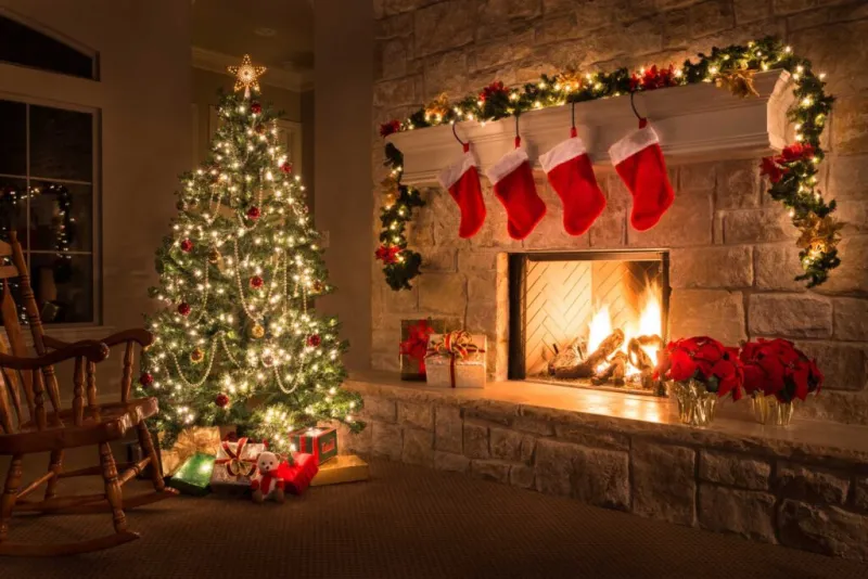 Holiday decorations around a fireplace illustrating the importance of fire safety during the season